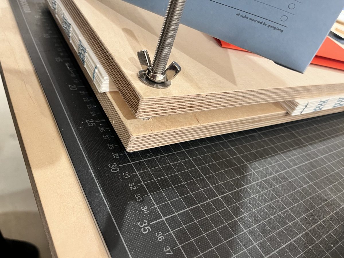 Books in a bookbinding press